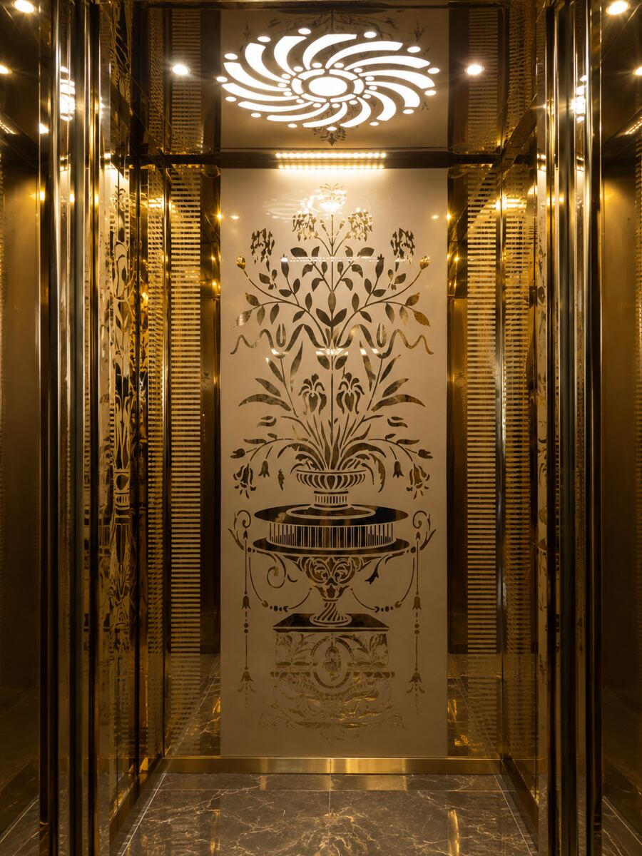 Golden etched stainless steel elevator cabin interior